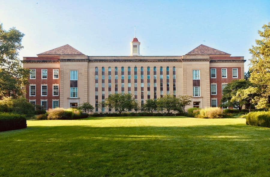 University campus building on a green lawn