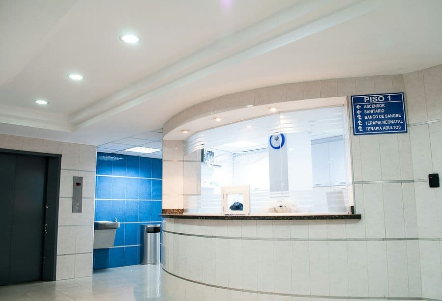 Bright healthcare reception with glass partitions