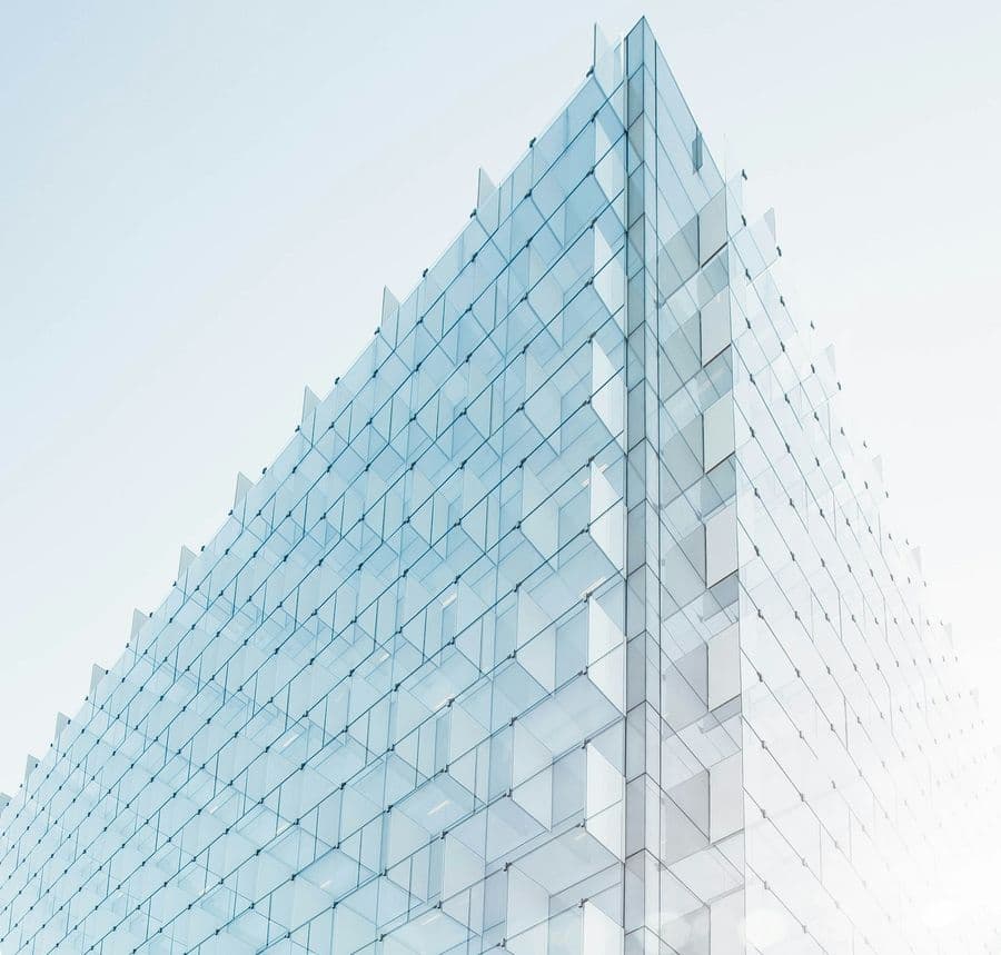 Blue patterned glass panels on a high-rise facade